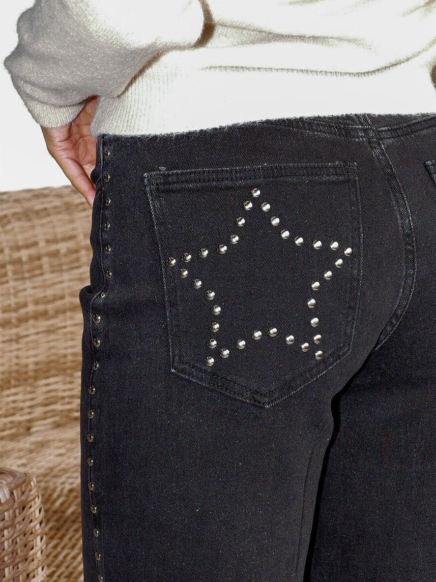 Calças de ganga pretas com tachas em forma de estrela